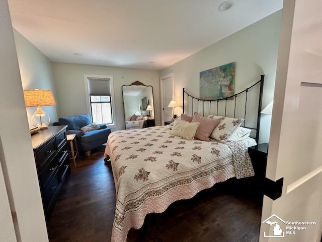 314 W Division St, Boyne City, MI 49712 - bedroom featuring dark wood-style flooring