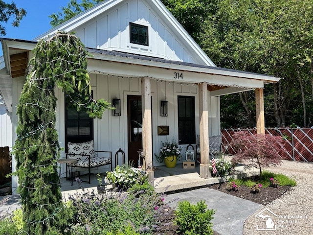 314 W Division St, Boyne City, MI 49712 - view of front of property featuring board and batten siding and covered porch