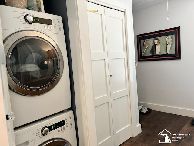 314 W Division St, Boyne City, MI 49712 - laundry room featuring estacked washer and dryer and dark wood-style flooring