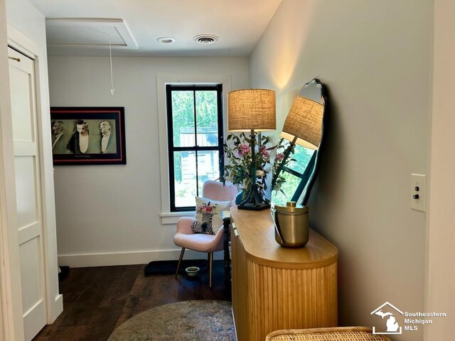 314 W Division St, Boyne City, MI 49712 - living area featuring attic access and dark wood-style floors