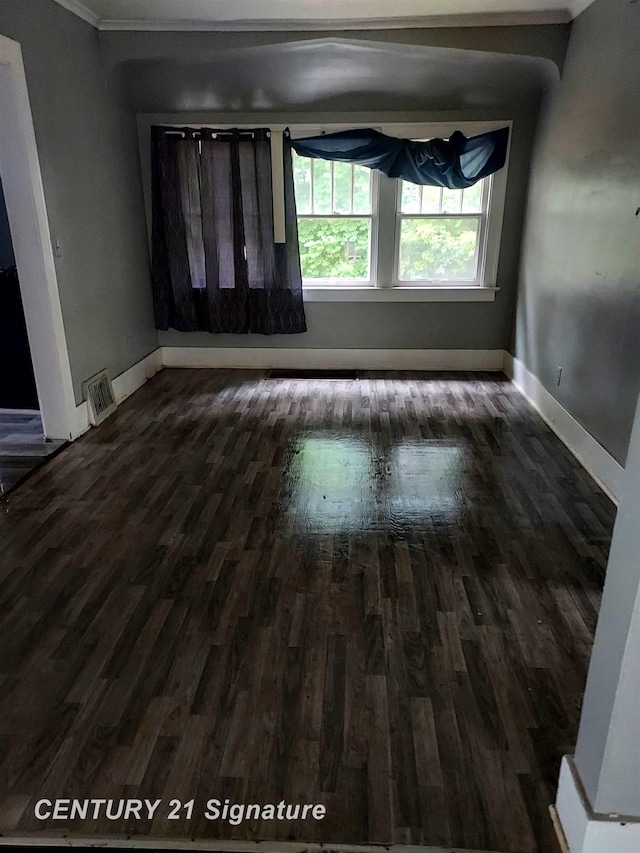 1205 Copeman Blvd, Flint, MI 48504 - empty room with dark wood-type flooring and ornamental molding