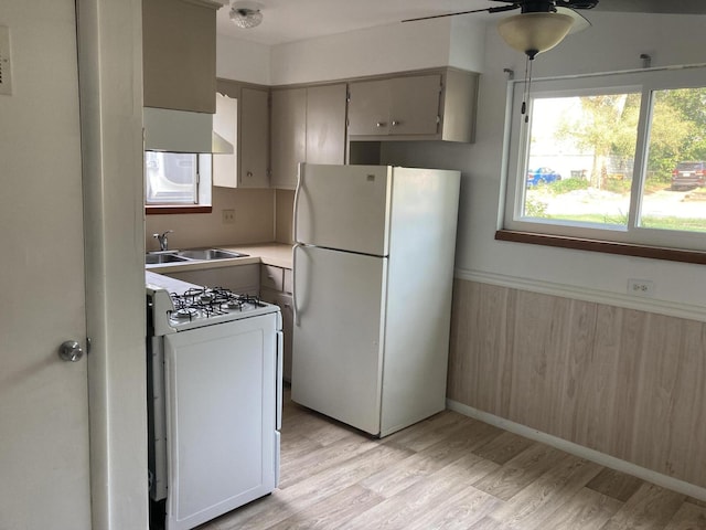 3607 Colby Ave SW, Wyoming, MI 49509 - kitchen featuring white appliances, light wood-style floors, ceiling fan, gray cabinetry, and light countertops