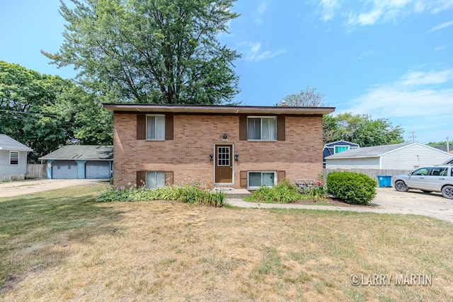 3607 Colby Ave SW, Wyoming, MI 49509 - view of front facade with brick siding, a front lawn, and a garage
