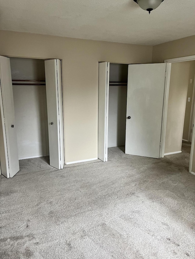3607 Colby Ave SW, Wyoming, MI 49509 - unfurnished bedroom with multiple closets and carpet