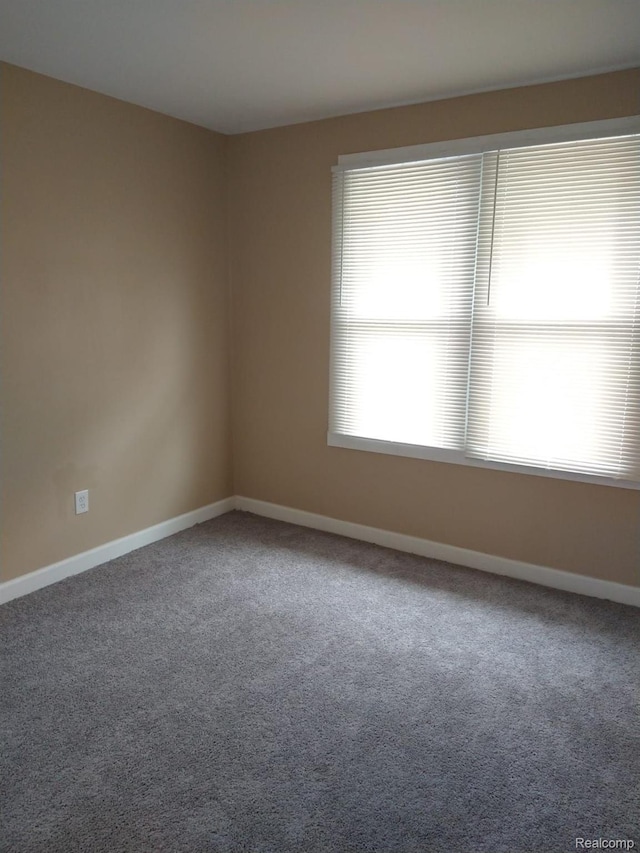 13340 Hartwell St, Detroit, MI 48227 - carpeted empty room featuring baseboards