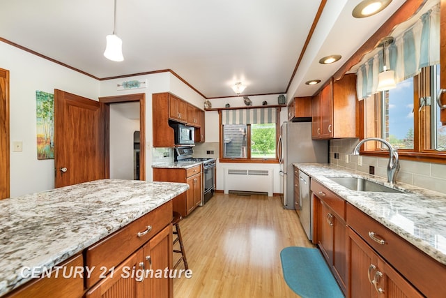9610 Saginaw St, Reese, MI 48757 - kitchen featuring appliances with stainless steel finishes, brown cabinetry, radiator heating unit, decorative backsplash, and light wood-style flooring