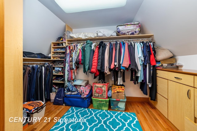 9610 Saginaw St, Reese, MI 48757 - walk in closet with light wood finished floors and lofted ceiling