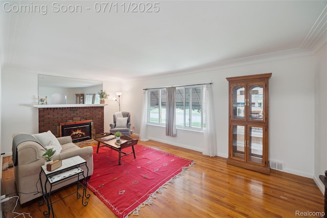 19190 Woodworth, Redford, MI 48240 - living room with wood finished floors, a brick fireplace, and crown molding