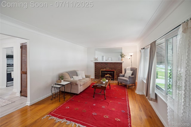 19190 Woodworth, Redford, MI 48240 - living room featuring a brick fireplace, wood finished floors, and crown molding