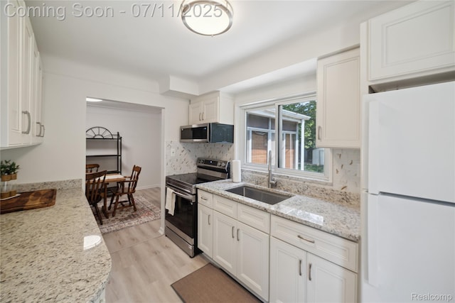 19190 Woodworth, Redford, MI 48240 - kitchen featuring appliances with stainless steel finishes, white cabinets, and backsplash