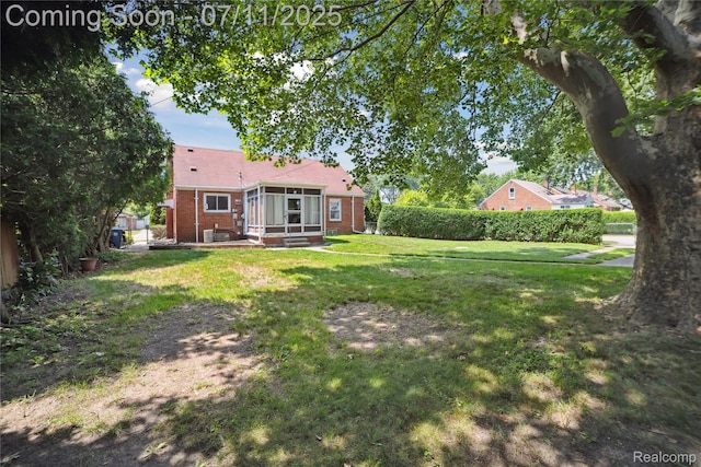 19190 Woodworth, Redford, MI 48240 - view of grassy yard with a sunroom and entry steps