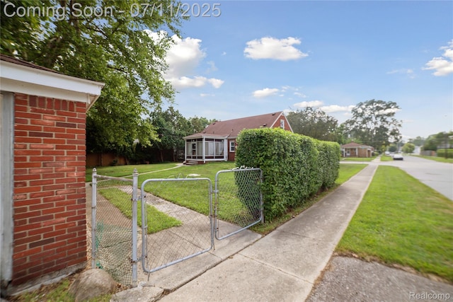 19190 Woodworth, Redford, MI 48240 - view of home's exterior featuring a gate, brick siding, and a sunroom