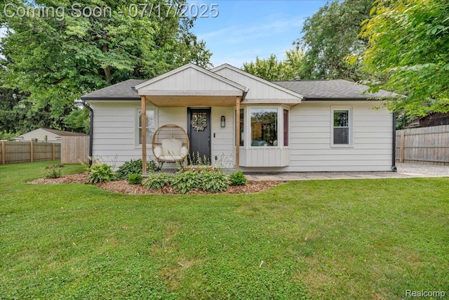 1133 Kingston Ave, Flint, MI 48507 - view of front of property featuring a shingled roof and a porch