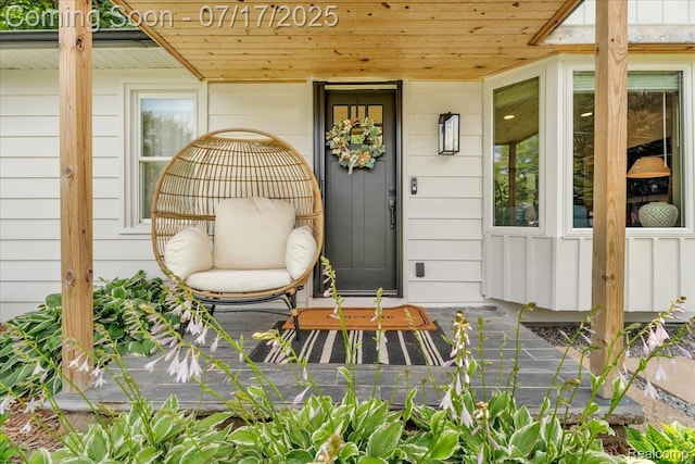 1133 Kingston Ave, Flint, MI 48507 - entrance to property with covered porch and board and batten siding