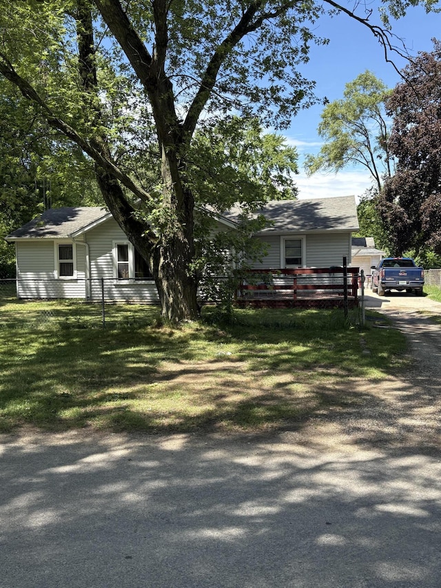 1993 Taube Ave, Benton Harbor, MI 49022 - view of front facade featuring driveway and a front yard