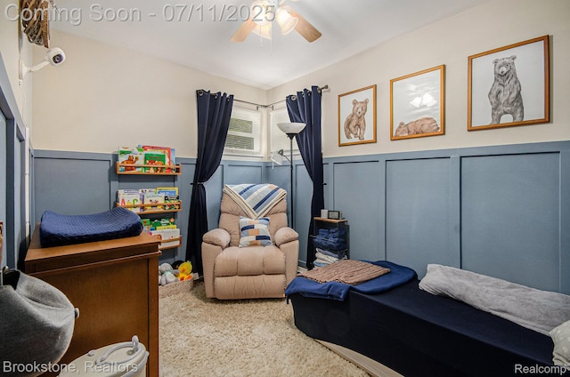 1510 S Harris Rd, Ypsilanti, MI 48198 - carpeted bedroom featuring wainscoting, a decorative wall, and ceiling fan