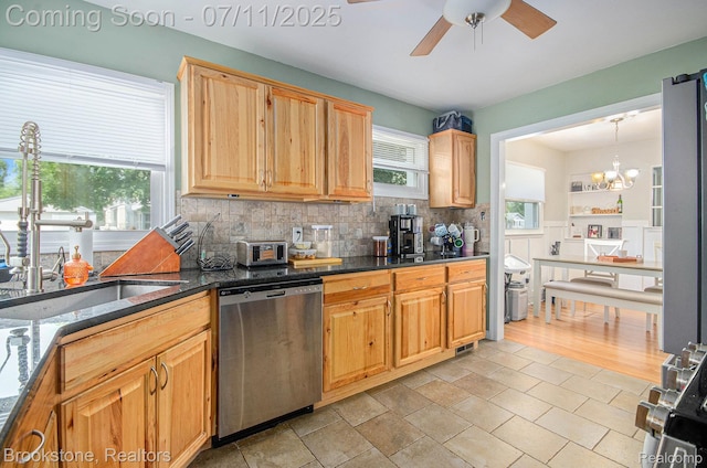 1510 S Harris Rd, Ypsilanti, MI 48198 - kitchen featuring stainless steel dishwasher, ceiling fan, backsplash, a chandelier, and dark stone countertops