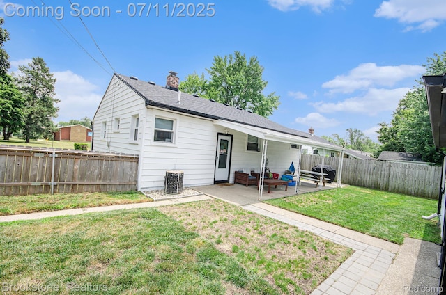 1510 S Harris Rd, Ypsilanti, MI 48198 - rear view of house featuring a patio, a fenced backyard, a chimney, and outdoor lounge area