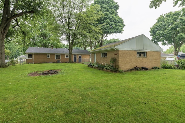 3026 Leigh Ave, Kalamazoo, MI 49048 - rear view of property featuring brick siding