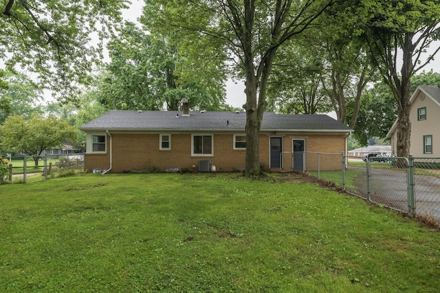 3026 Leigh Ave, Kalamazoo, MI 49048 - back of house with a gate, brick siding, and a fenced backyard