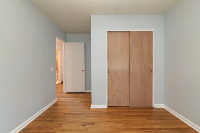 3026 Leigh Ave, Kalamazoo, MI 49048 - unfurnished bedroom featuring light wood-type flooring and a closet