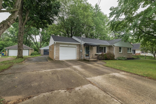 3026 Leigh Ave, Kalamazoo, MI 49048 - ranch-style home featuring a garage, a front lawn, concrete driveway, and roof with shingles