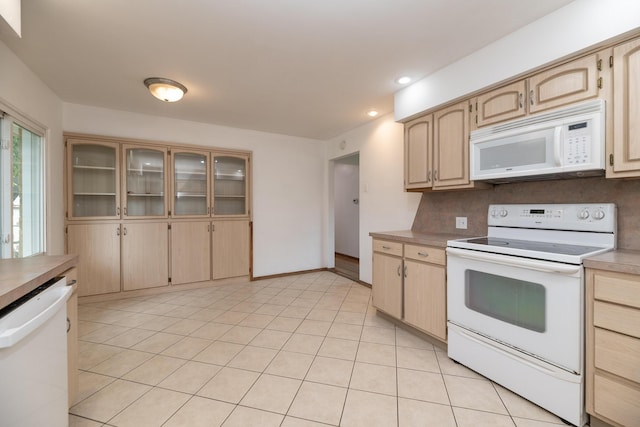 3026 Leigh Ave, Kalamazoo, MI 49048 - kitchen featuring white appliances, light brown cabinets, recessed lighting, glass insert cabinets, and light countertops
