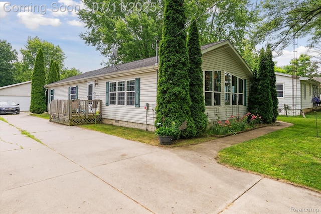3410 Eastdale Dr, Flint, MI 48506 - view of front facade with an outbuilding and a front yard