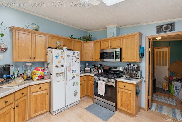 3410 Eastdale Dr, Flint, MI 48506 - kitchen featuring appliances with stainless steel finishes, light wood-type flooring, light countertops, a textured ceiling, and crown molding