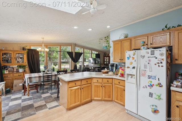 3410 Eastdale Dr, Flint, MI 48506 - kitchen with white refrigerator with ice dispenser, a peninsula, a textured ceiling, ceiling fan, and a chandelier