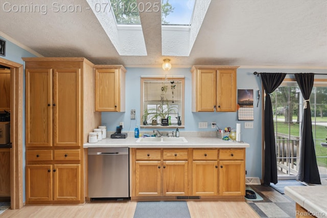 3410 Eastdale Dr, Flint, MI 48506 - kitchen featuring dishwasher, a skylight, light countertops, light wood-type flooring, and ornamental molding