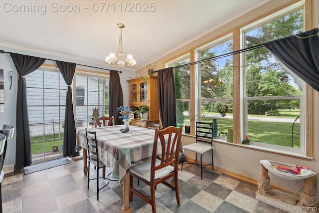 3410 Eastdale Dr, Flint, MI 48506 - dining room featuring ornamental molding, a chandelier, and stone finish floors