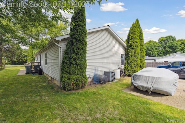 3410 Eastdale Dr, Flint, MI 48506 - view of property exterior with a central AC unit and a yard