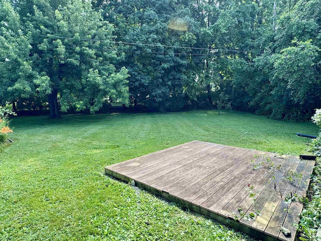 652 Lincoln Ct, Lapeer, MI 48446 - view of grassy yard with a wooden deck