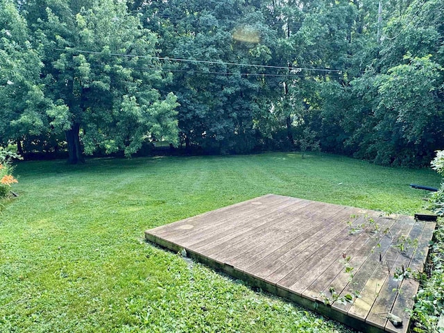 652 Lincoln Ct, Lapeer, MI 48446 - view of grassy yard with a wooden deck