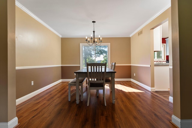 2017 Cumberland Dr, Brighton, MI 48114 - dining space with a chandelier, dark wood-style floors, and ornamental molding