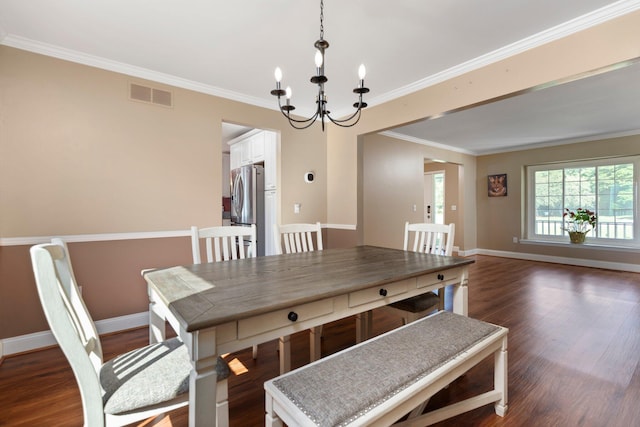 2017 Cumberland Dr, Brighton, MI 48114 - dining room featuring a chandelier, dark wood finished floors, and crown molding