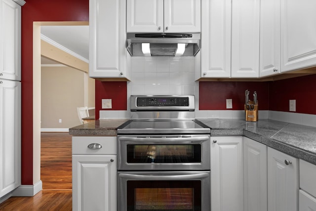 2017 Cumberland Dr, Brighton, MI 48114 - kitchen featuring double oven range, tile counters, exhaust hood, and white cabinetry