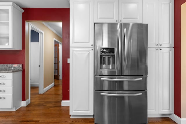 2017 Cumberland Dr, Brighton, MI 48114 - kitchen featuring stainless steel fridge, dark wood finished floors, glass insert cabinets, white cabinetry, and ornamental molding