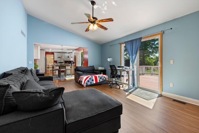 2017 Cumberland Dr, Brighton, MI 48114 - living area with vaulted ceiling, wood finished floors, and ceiling fan