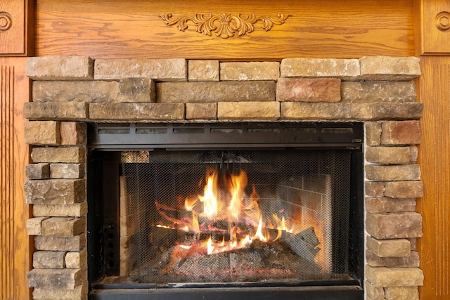 2017 Cumberland Dr, Brighton, MI 48114 - detailed view of a warm lit fireplace