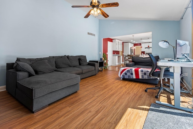 2017 Cumberland Dr, Brighton, MI 48114 - home office featuring a ceiling fan, vaulted ceiling, and wood finished floors
