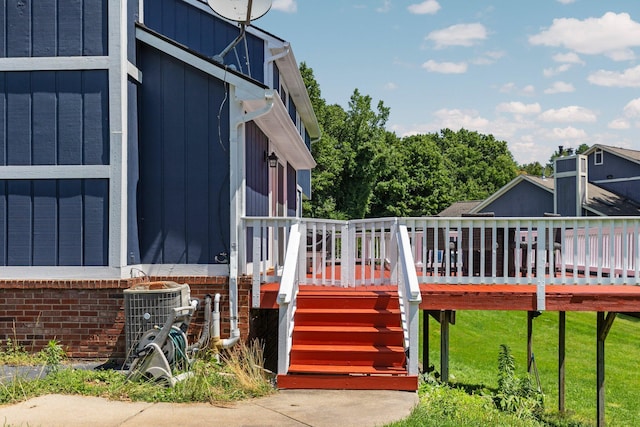 2017 Cumberland Dr, Brighton, MI 48114 - view of side of property with a wooden deck, stairway, and a yard