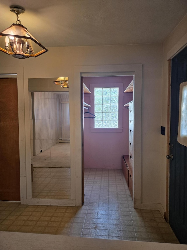 505 N Pine St, Evart, MI 49631 - foyer featuring a chandelier and tile patterned floors