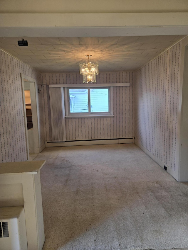 505 N Pine St, Evart, MI 49631 - unfurnished dining area featuring wallpapered walls, a chandelier, and carpet floors