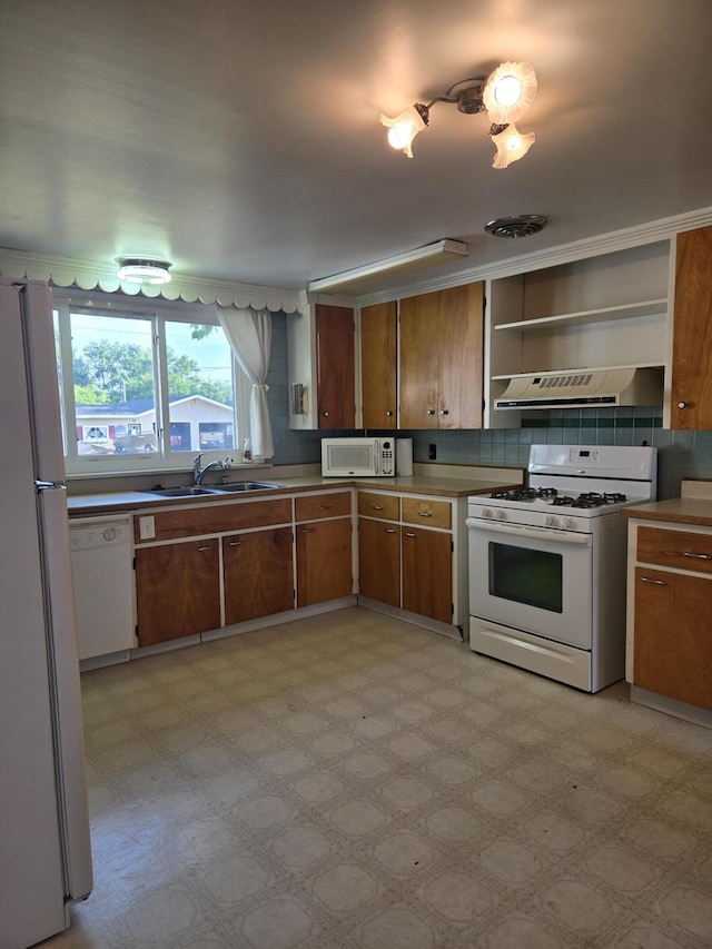 505 N Pine St, Evart, MI 49631 - kitchen featuring white appliances, ventilation hood, light flooring, brown cabinets, and open shelves