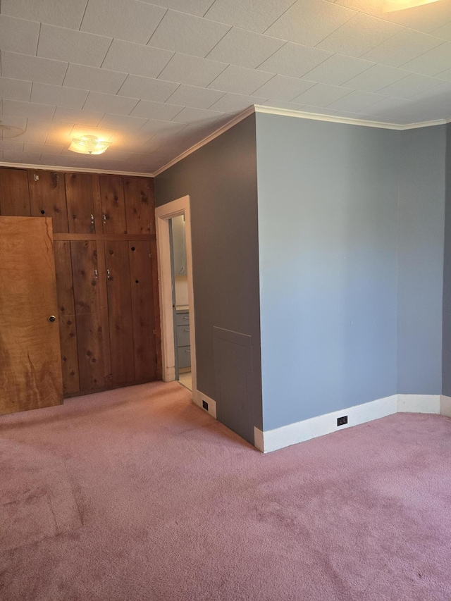 505 N Pine St, Evart, MI 49631 - carpeted spare room with ornamental molding and baseboards