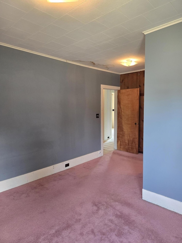 505 N Pine St, Evart, MI 49631 - carpeted empty room with ornamental molding and baseboards