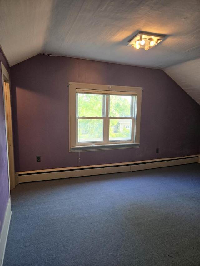 505 N Pine St, Evart, MI 49631 - bonus room featuring lofted ceiling, carpet flooring, and a baseboard radiator