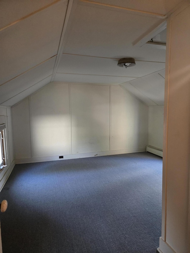 505 N Pine St, Evart, MI 49631 - bonus room featuring vaulted ceiling, baseboard heating, and carpet floors